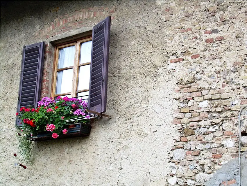Italian style villa with flower box in window
