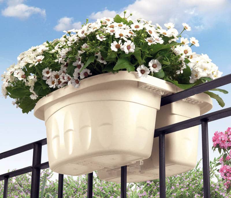 Metal fence rail planter with flowers