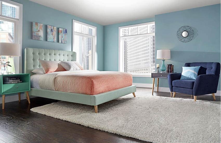 Mid century modern bedroom, blue decor and white area rug