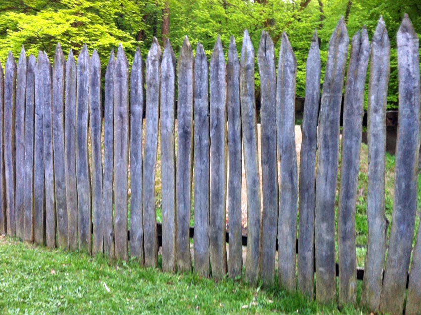 Rough wood picket stockade fence