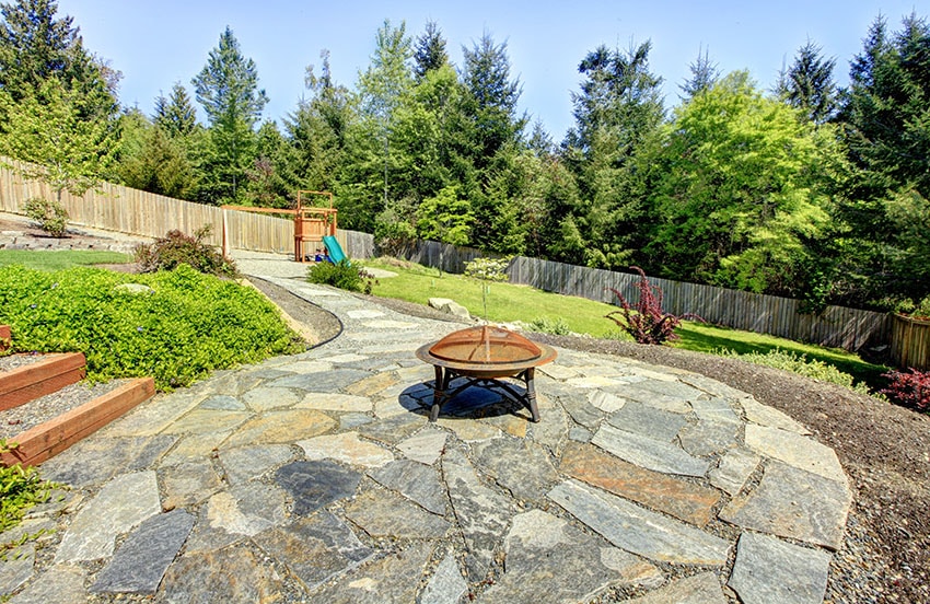 Tan and gray colored flagstones with portable firepit