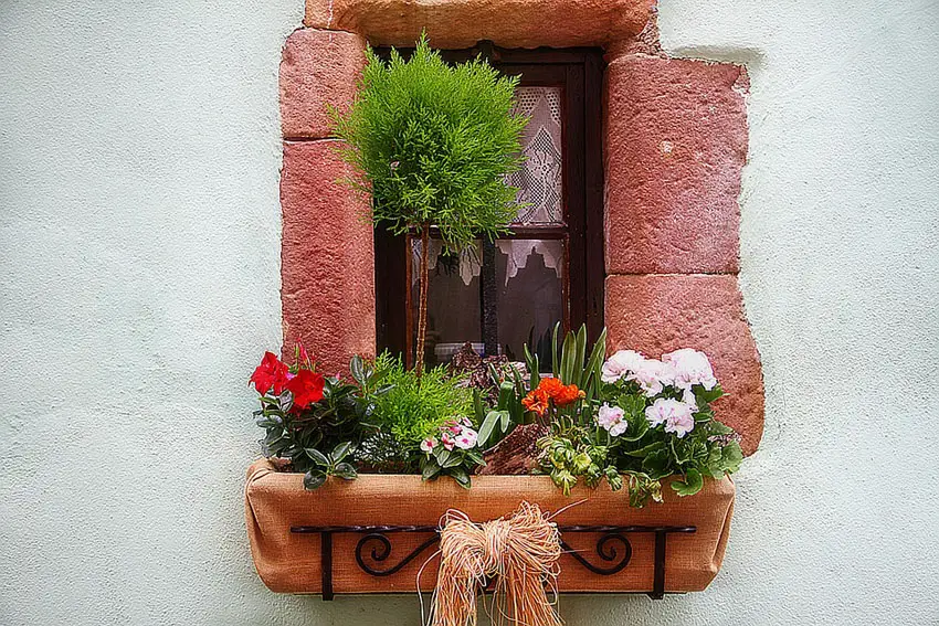 Rustic window flower box with wrought iron