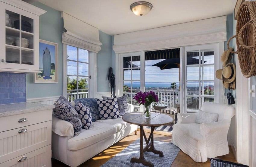 Small beautiful sunroom with white and aqua colors cottage theme and ocean views