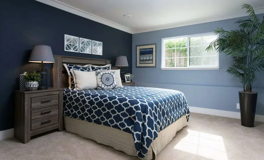 Two-toned blue bedroom with marble tile flooring