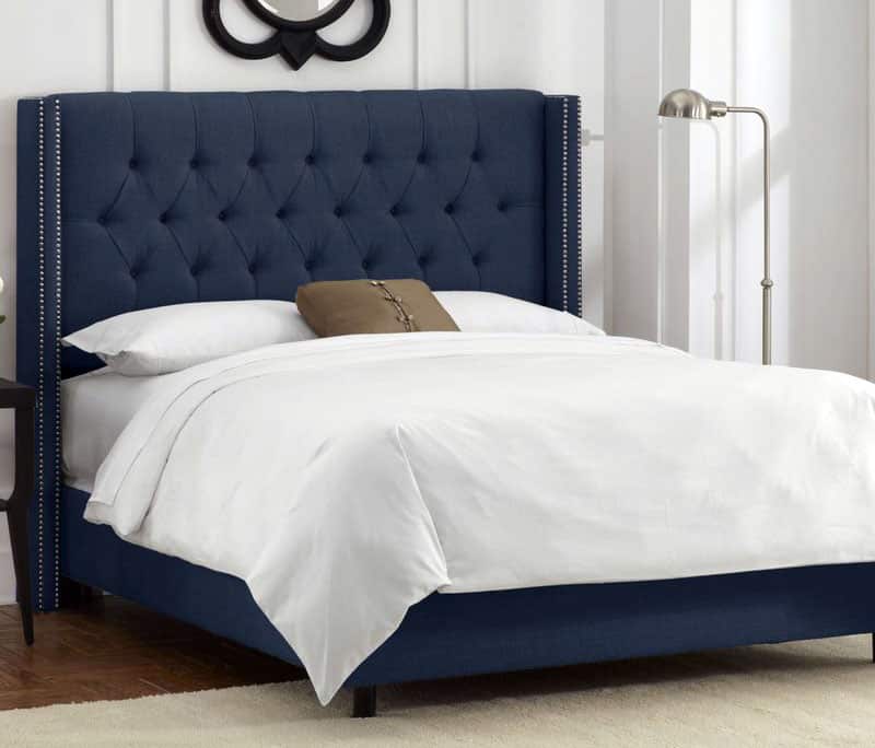 Upholstered tufted panel bed in dark blue