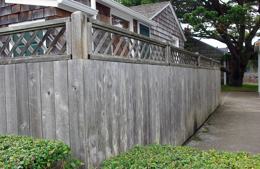 Weathered redwood fence with lattice top