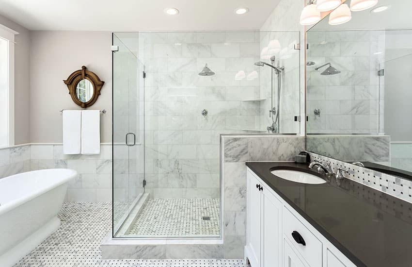 White bathroom with frameless door shower with clear glass