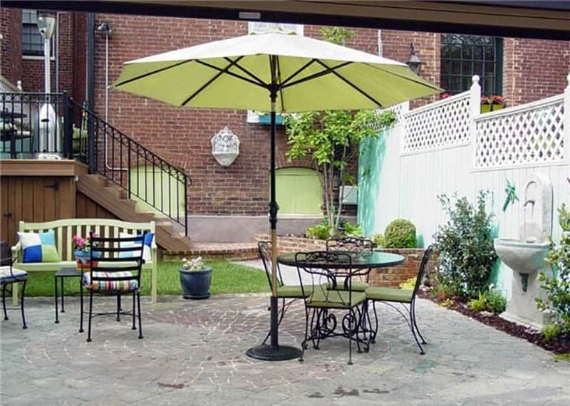 White privacy fence with lattice top around backyard patio