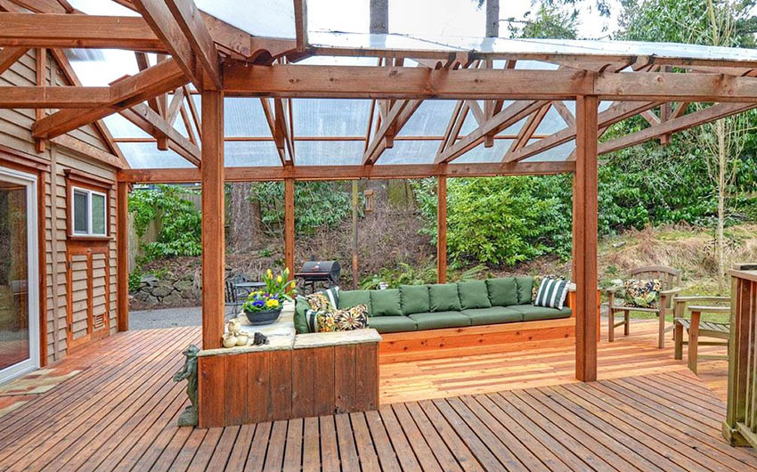 Wood deck pergola with arched design and plastic canopy