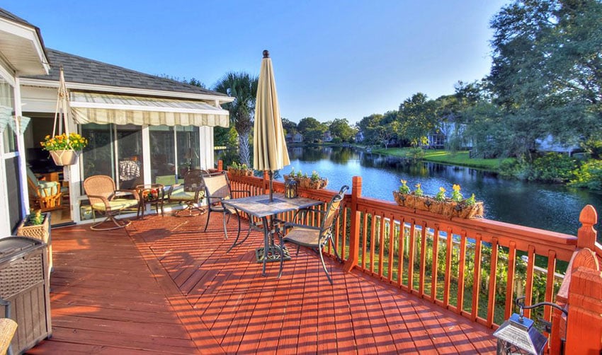 Wood deck with fence flower box planters and river views