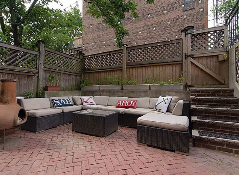 Brick paver patio in herringbone pattern design