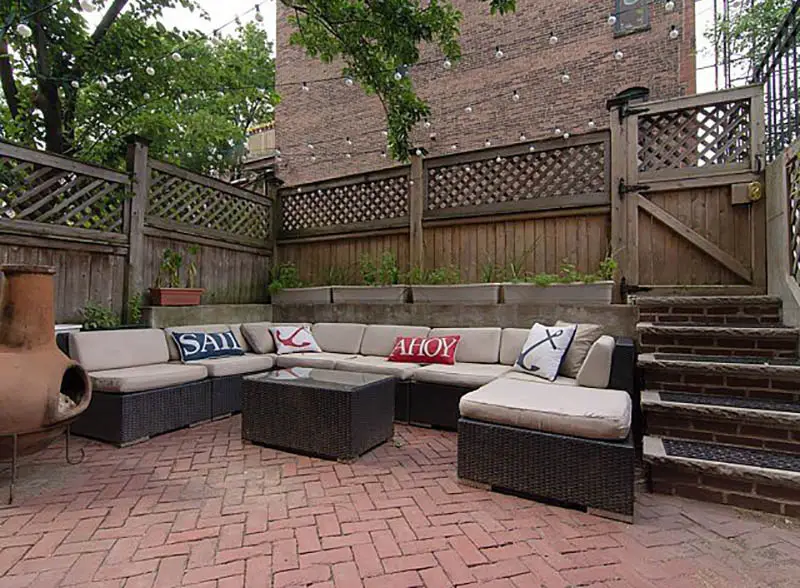 Patio with fence, pavers and outdoor fireplace
