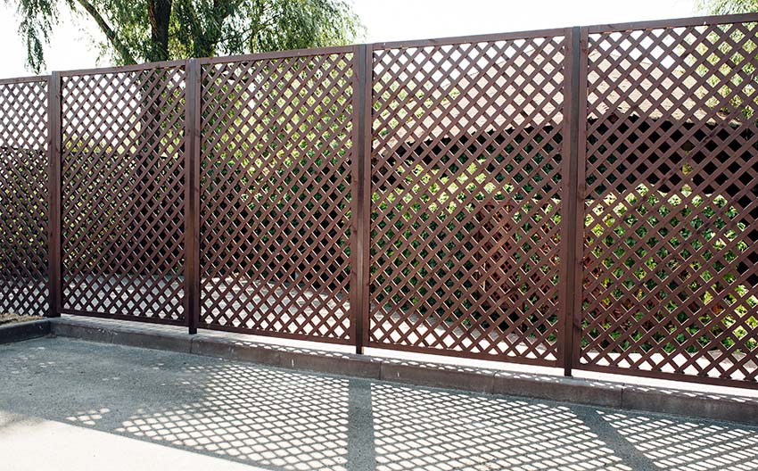 Wood lattice fence with grid design