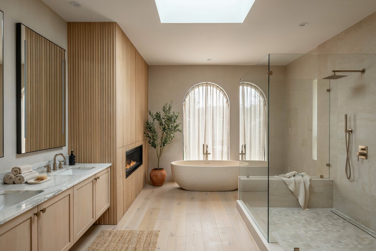 Bathroom with glass style shower with bench and fireplace