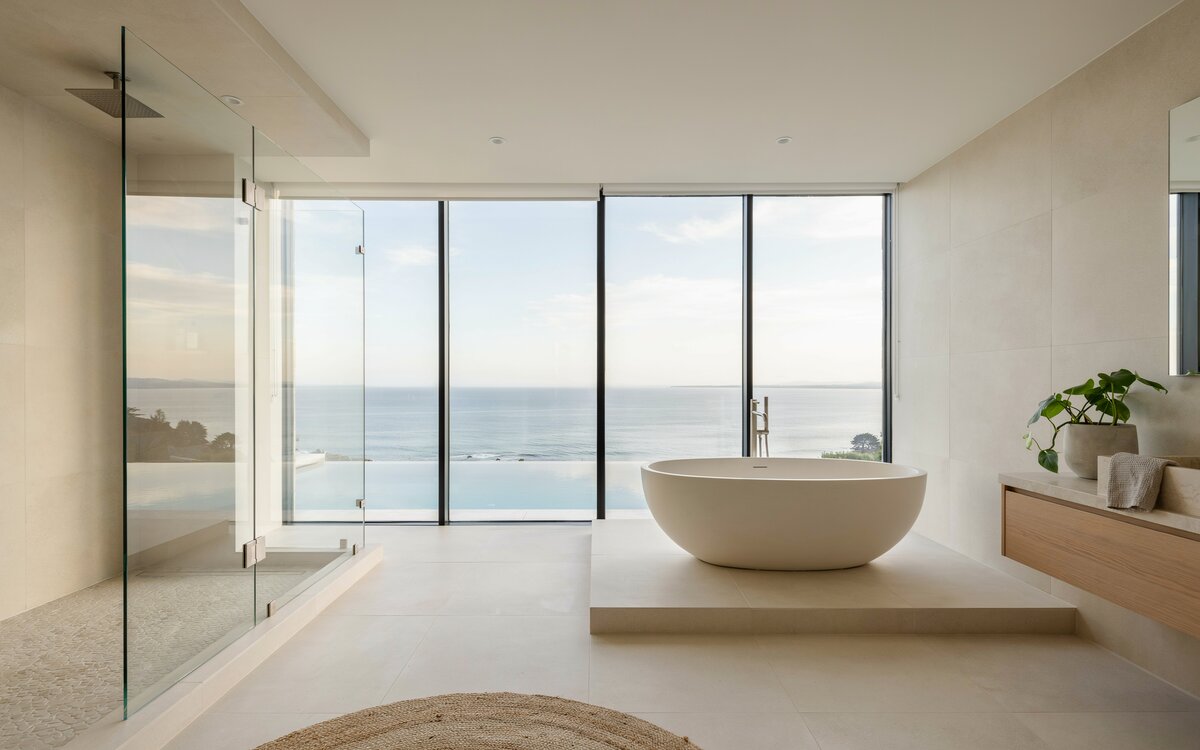 Luxury oceanview shower with floor to ceiling glass window