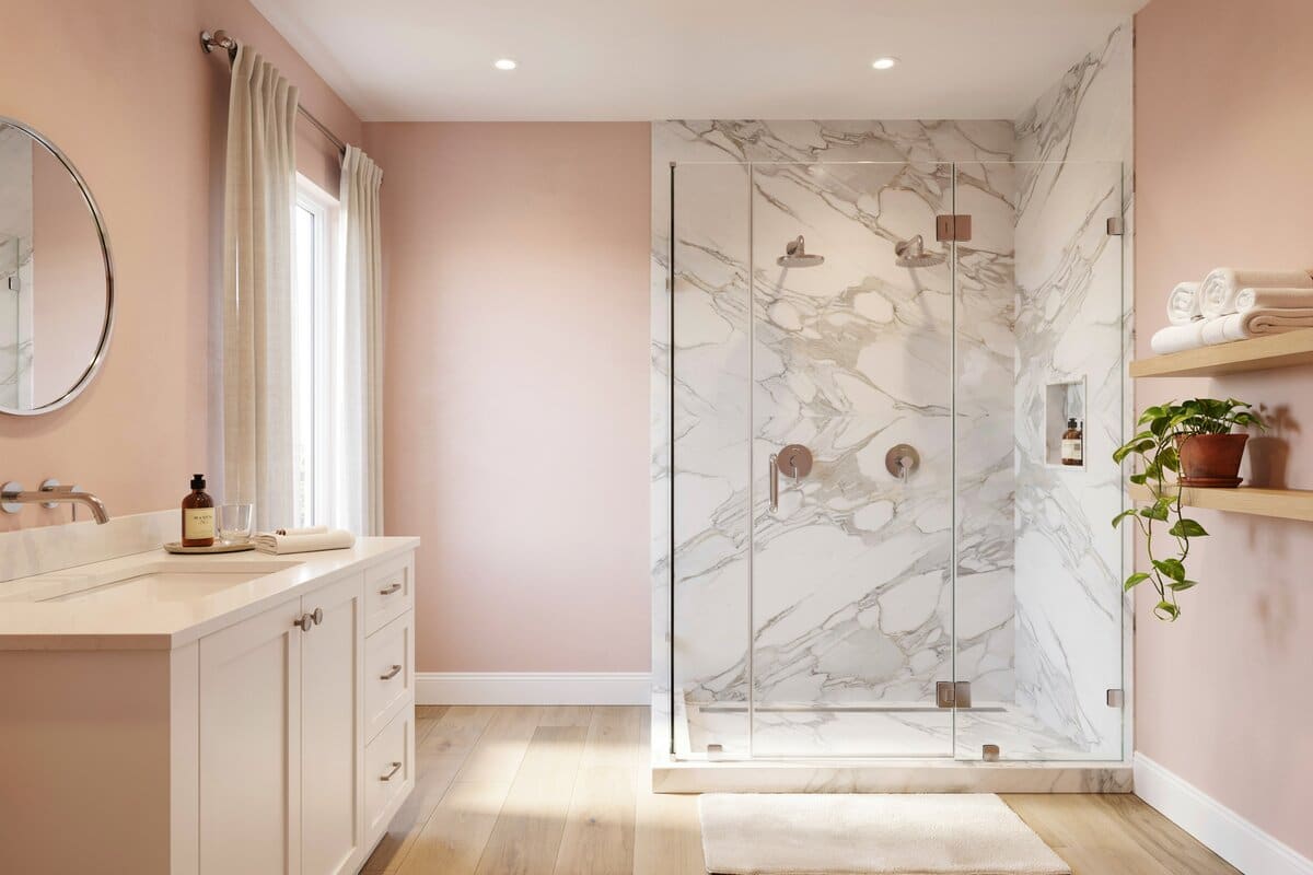 Bathroom with dual showerhead shower and white cabinetry