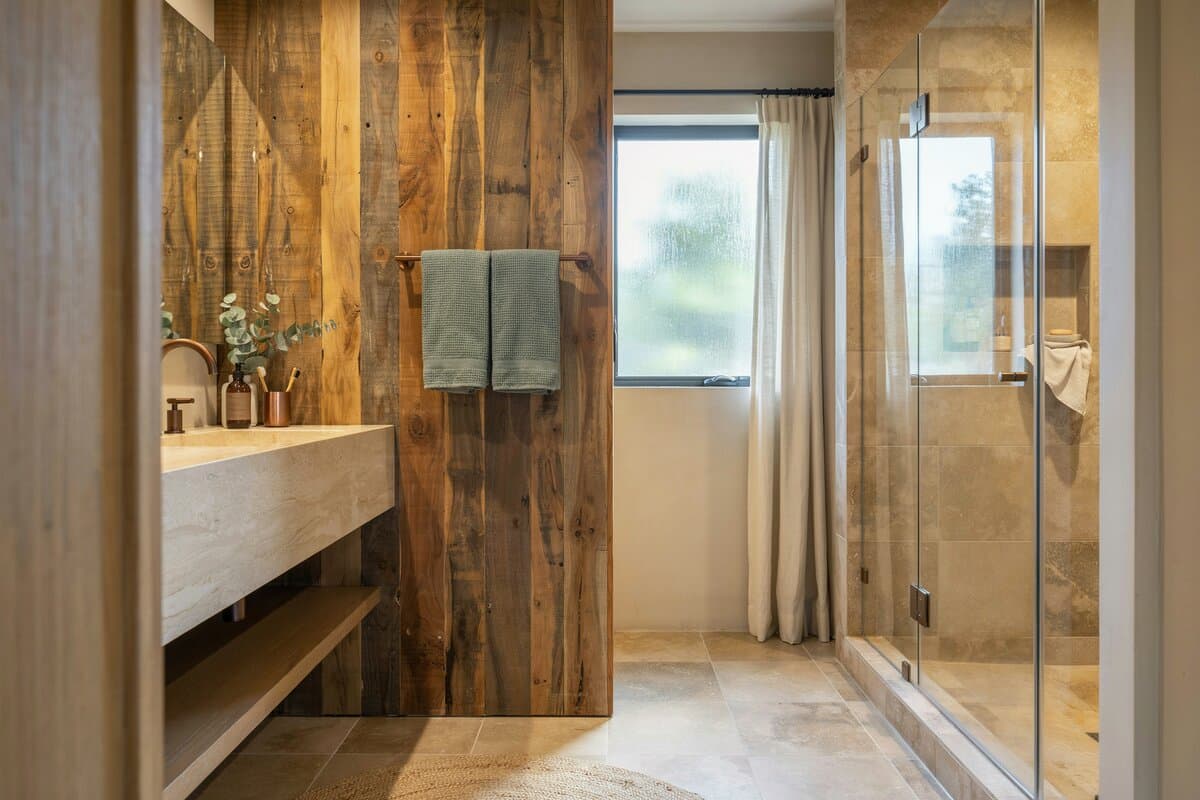 Rustic bathroom with towel rack and bathrobe