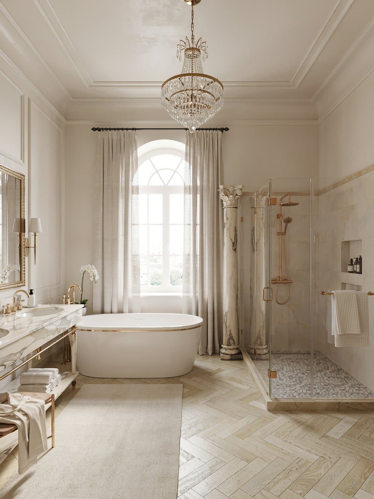 Walls with faux marble finish ornamental columns, crystal chandelier and gold bathroom fixtures