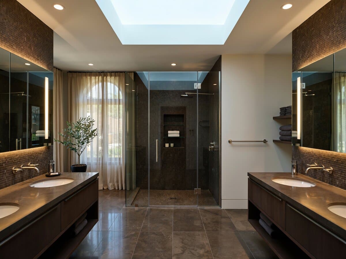 Bathroom with dark brown vanities green tinted partitions