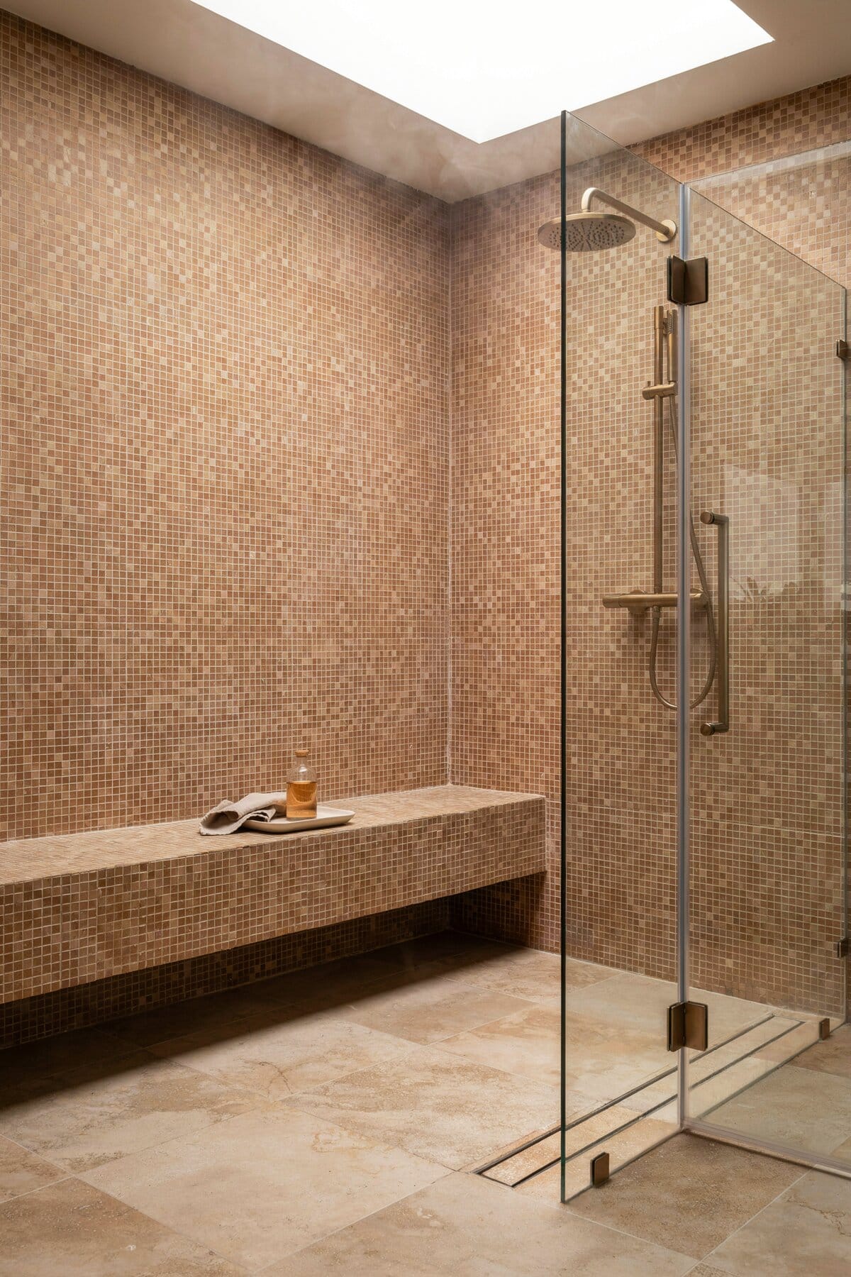 Warm toned bathroom with cream pixel like tiles
