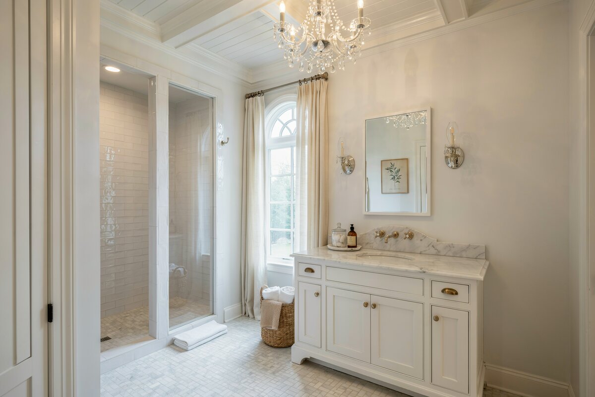 Basketweave style tiles, French cabinets, white windows with blinds