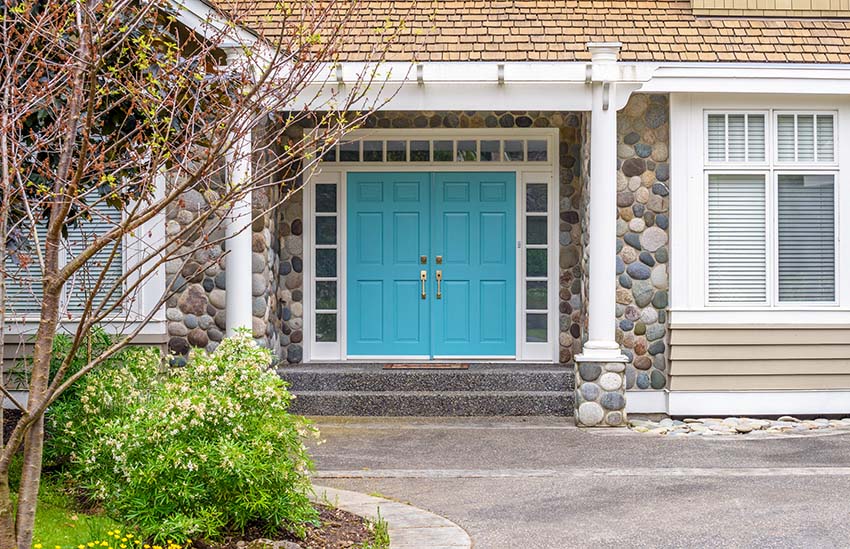 Aqua blue front door on house
