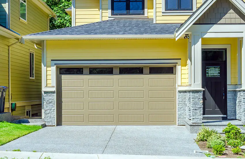 Beige vinyl door, black porch door and yellow wall paint