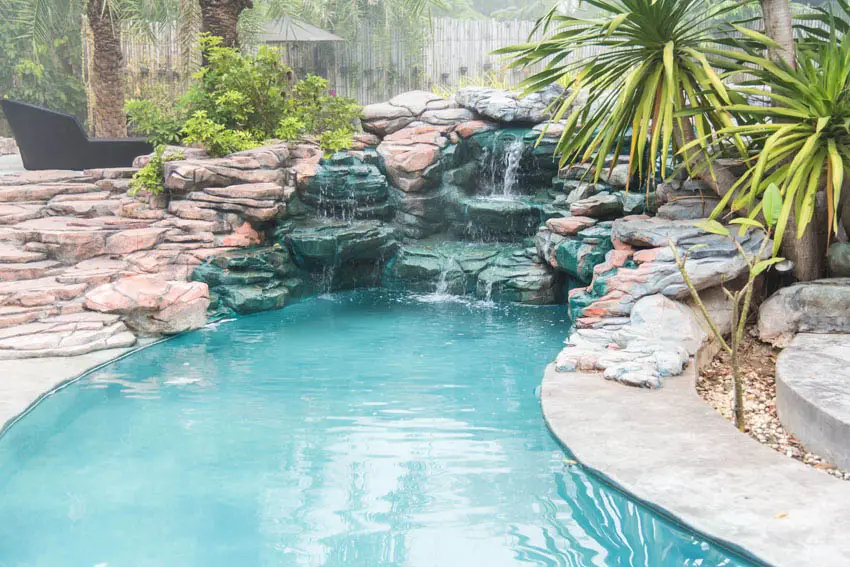 Custom rock swimming pool with waterfalls