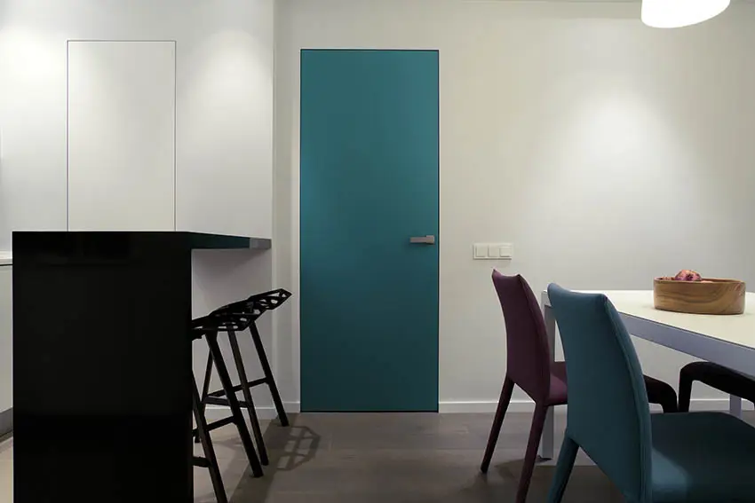 Green metal door in apartment