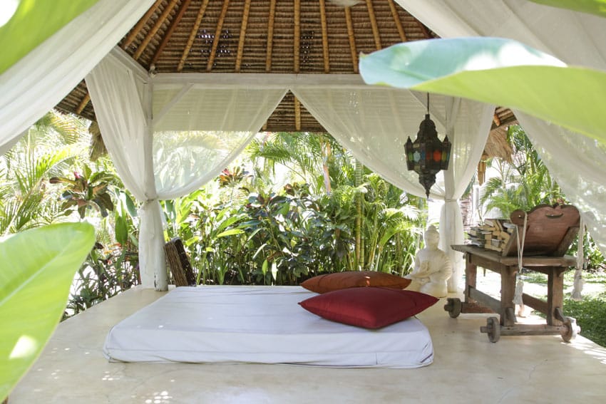 Luxury pavilion with day bed in tropical setting