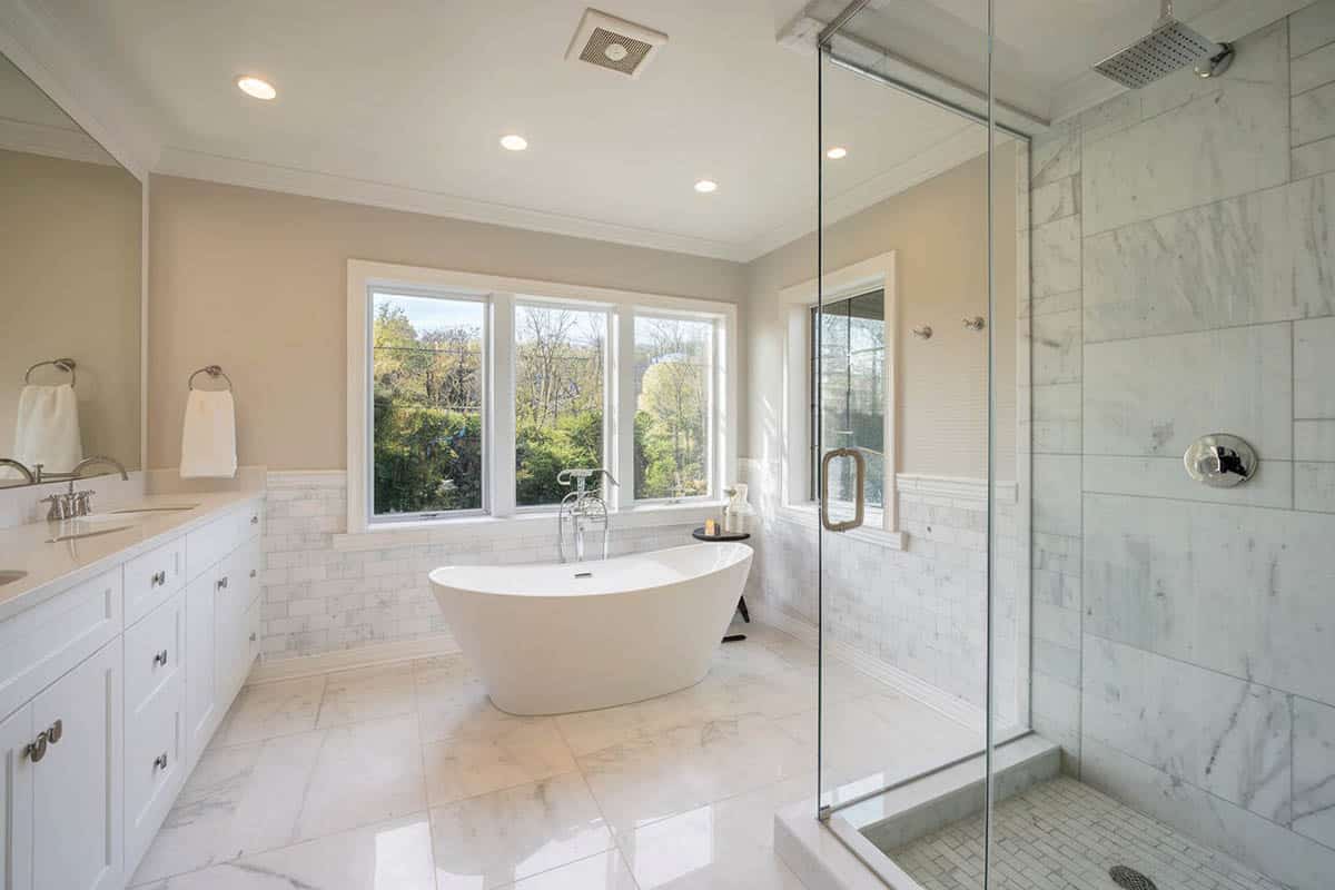 Bathroom with white tub and tile in the shower