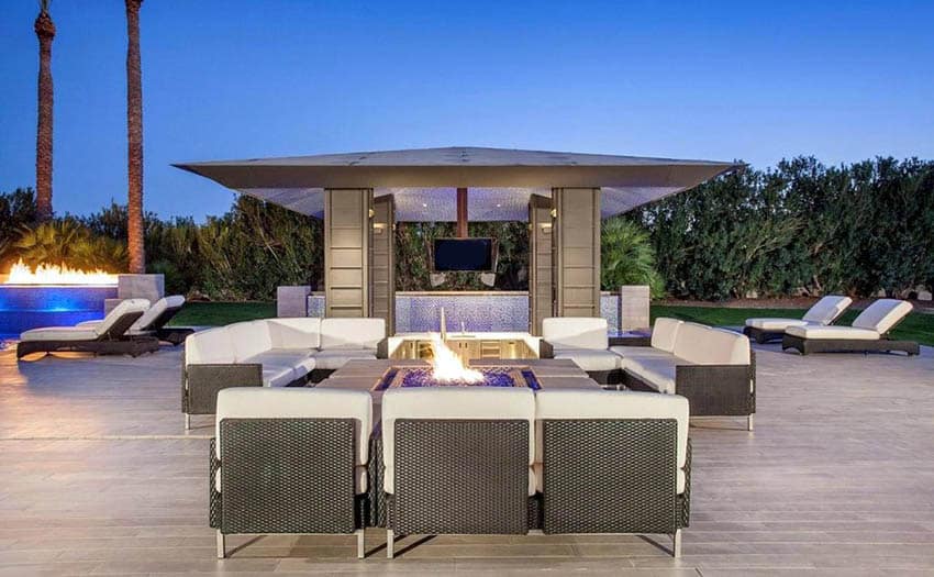 Modern luxury patio with tile floors and pavilion with outdoor television