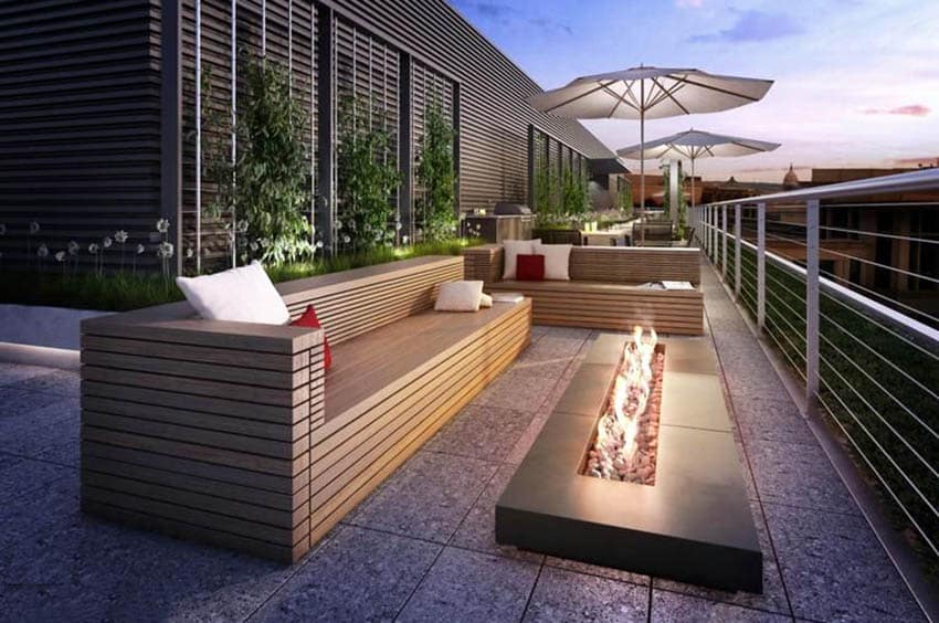 Modern patio with rectangular gas fire pit and stainless steel railings