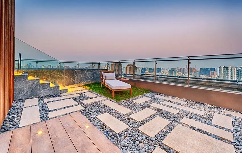 Rooftop patio with rocks and grass lounge area