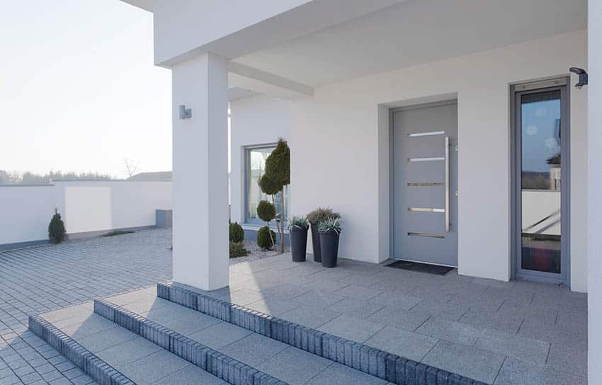 Modern white house with light blue front door