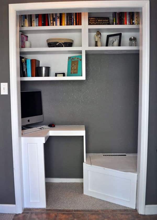 Small home office in closet with shelving
