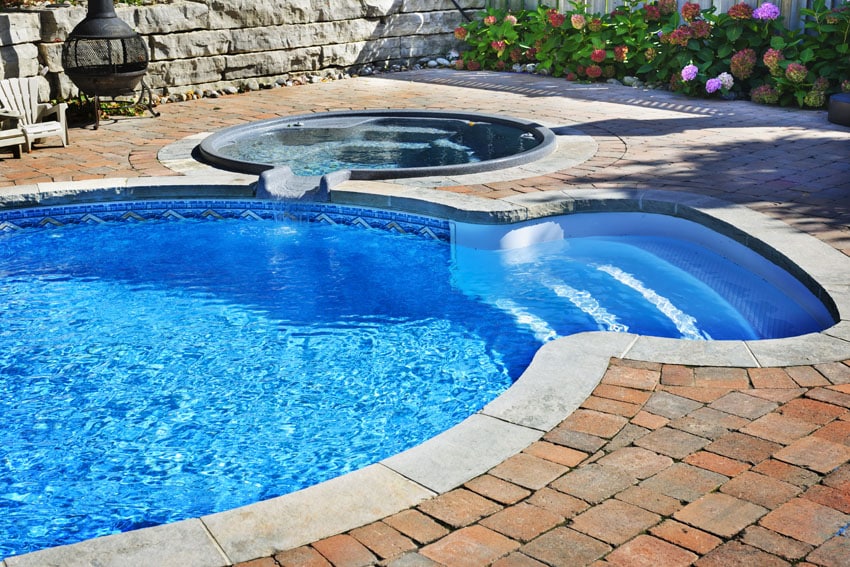 Pool with hot tub and round entry
