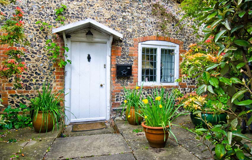 Traditional stone cottage and door with vertical panels