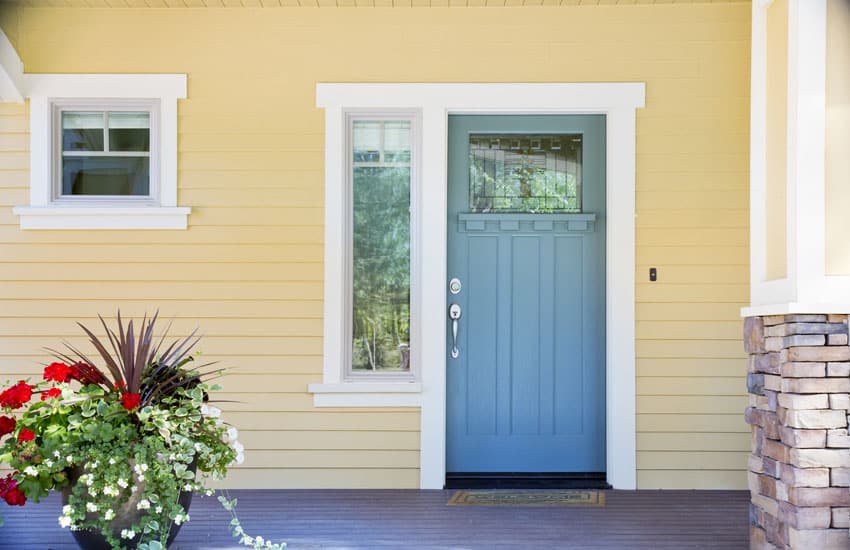 Yellow house with light blue door