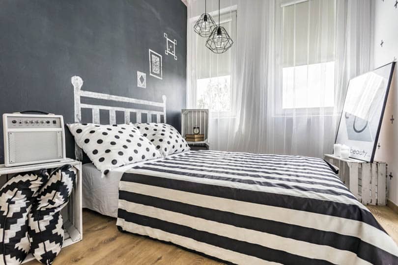 Cool bedroom with chalkboard walls and black and white theme