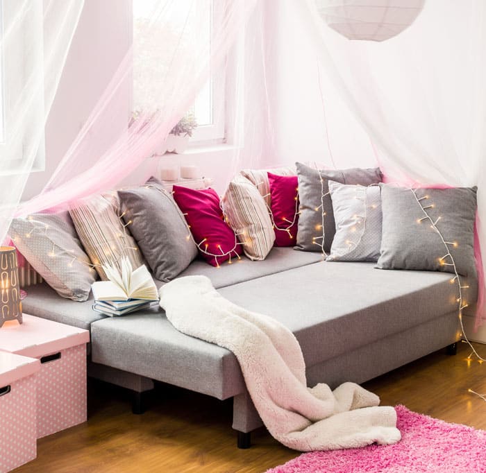 Cozy daybed with lights in girls bedroom