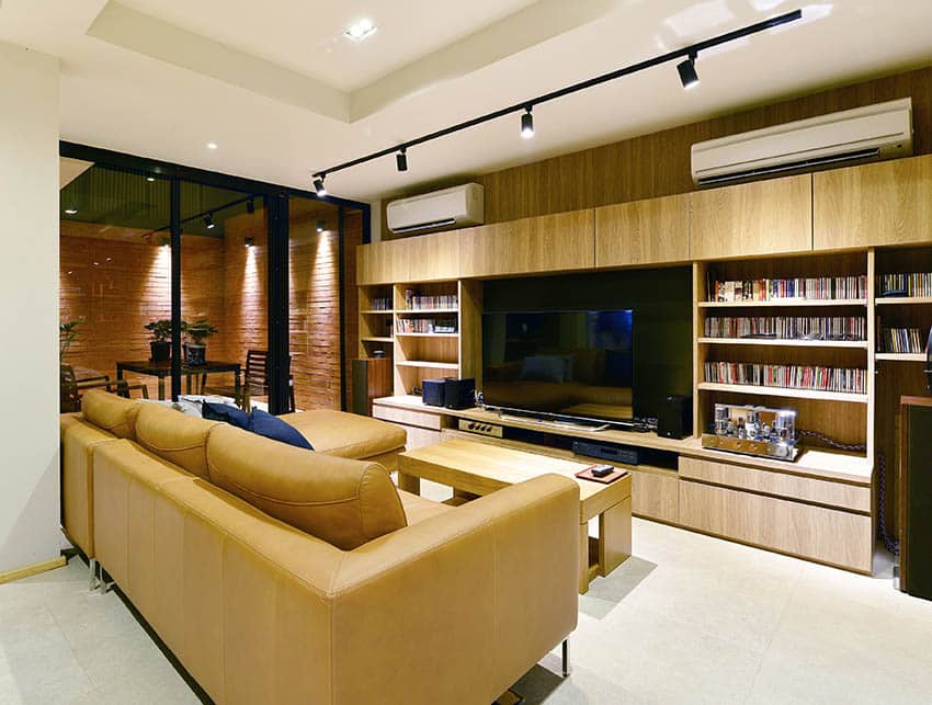 Living room with leather couch and large entertainment center
