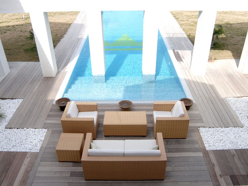 Pool with pillars and wood deck