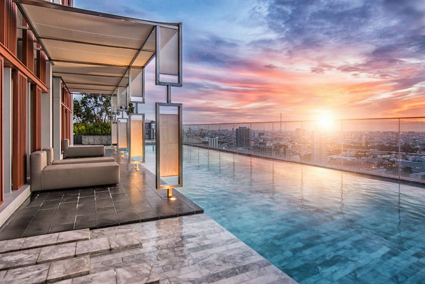 Modern penthouse swimming pool with cabana and city views
