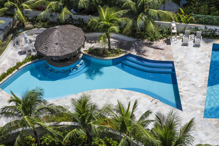 Tropical resort modern pool with geometric bridge design