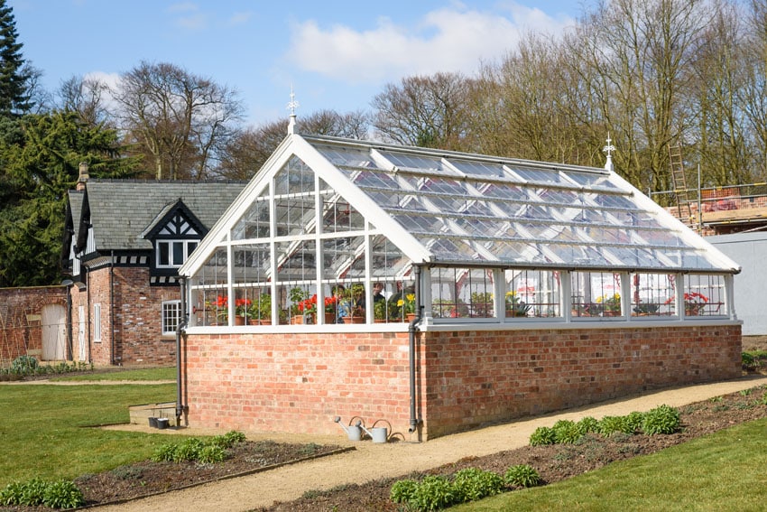 White wood and brick greenhouse