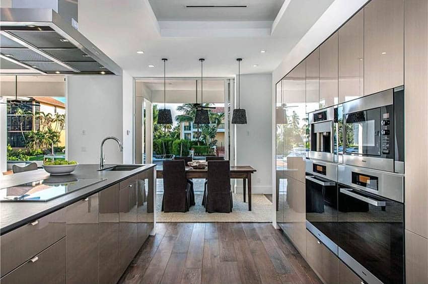 kitchen with acrilux cabinets soapstone countertops and hickory wood plank flooring