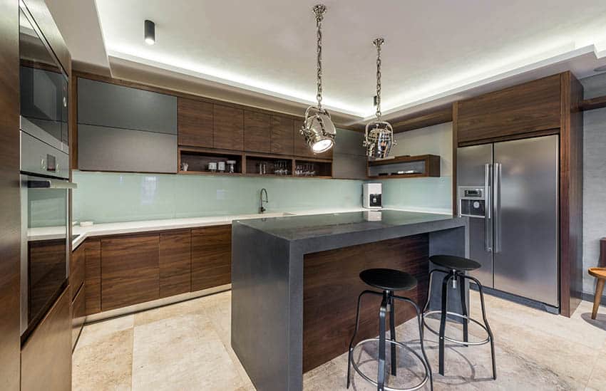 kitchen with dark tone cabinets and island with gray solid surface countertop