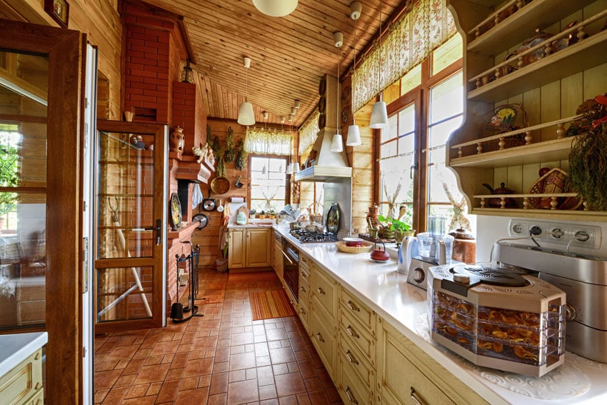 Galley style log style kitchen with polished brick floors