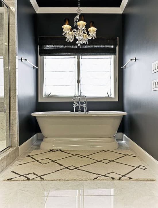 Master bathroom with marble style vinyl tile floor and pedestal tub